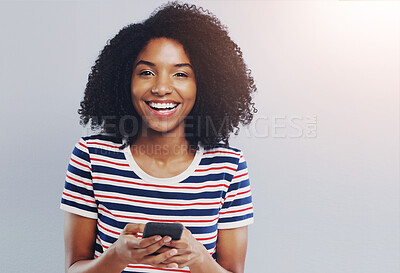 Buy stock photo Studio, portrait and African woman with smartphone for chat, laugh and online connection with contact. Female person, social media and cellphone with mobile app, gossip and mockup by gray background