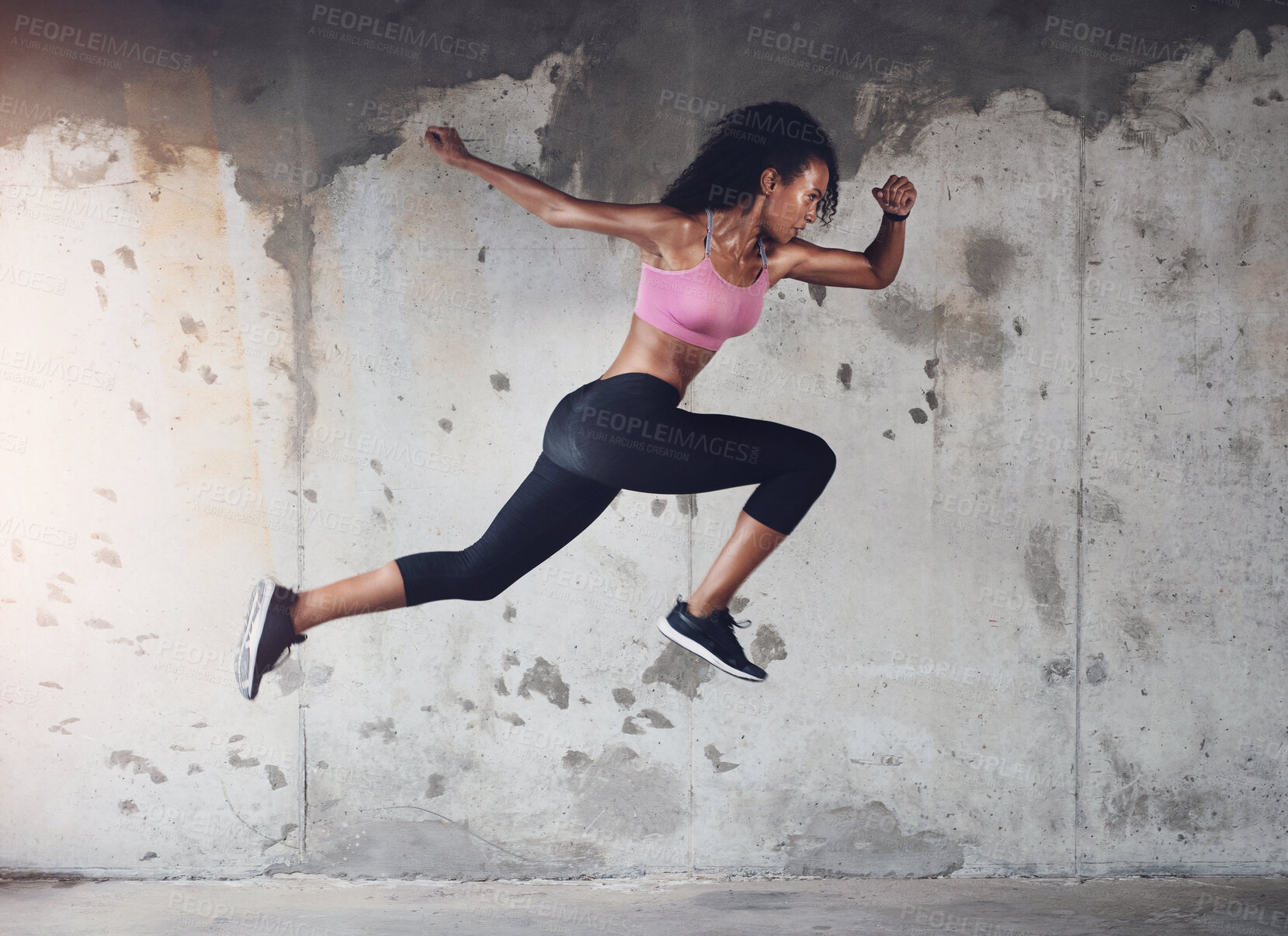 Buy stock photo Sports, running and woman with speed in city for workout, marathon training or endurance challenge. Fitness, wellness and hispanic athlete with jump for morning cardio, energy or race in urban town