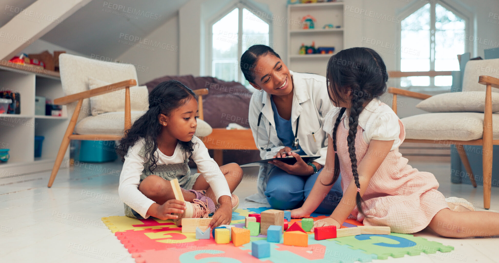 Buy stock photo Healthcare, children and therapist for play therapy, session and consultation with little girl. Medical, psychologist and kids with toys to engage, skill development and clipboard to record progress