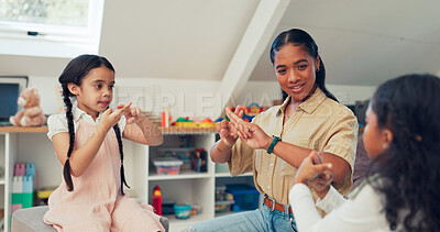 Buy stock photo Girl, kids and therapist for speech therapy, communication and sign language for verbal disorder. Woman, children and learning for technique or skill for vocal development, activity and exercise.