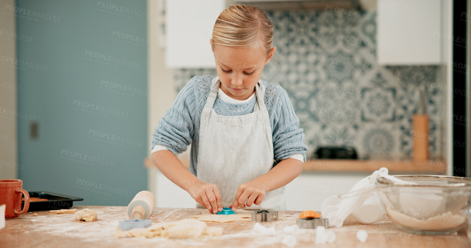 Buy stock photo Baking, cookies and girl in home kitchen, alone and dessert for cake food in family house. Recipe, shapes and ingredients for bake sale at school, cooking and puff pastry for dough and sweet snack