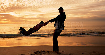 Buy stock photo Dad, son and swing on beach at sunset for family bonding, travel for wellness with energy Father, boy child and playful fun by ocean with sand on vacation, adventure or freedom in Indonesia