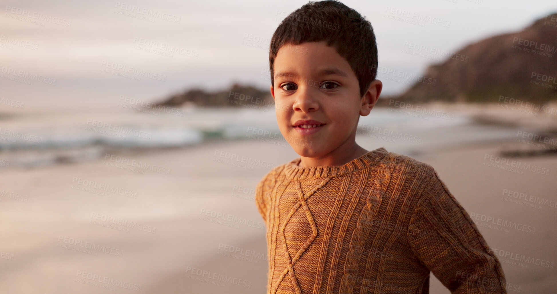 Buy stock photo Boy, child and portrait on beach, travel and explore nature or waves of ocean on vacation. Male person, kid and sea for wellness or play in Florida on weekend, water and relax on holiday adventure