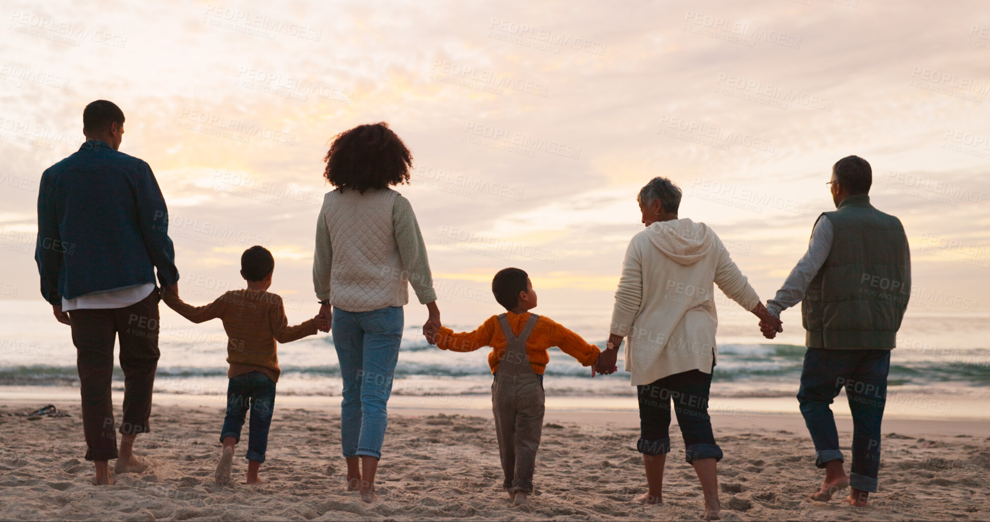 Buy stock photo Family, holiday and holding hands at beach in summer for relax, travel and vacation as silhouette. People, children and back at ocean with solidarity for walking, trust and love together by sunset