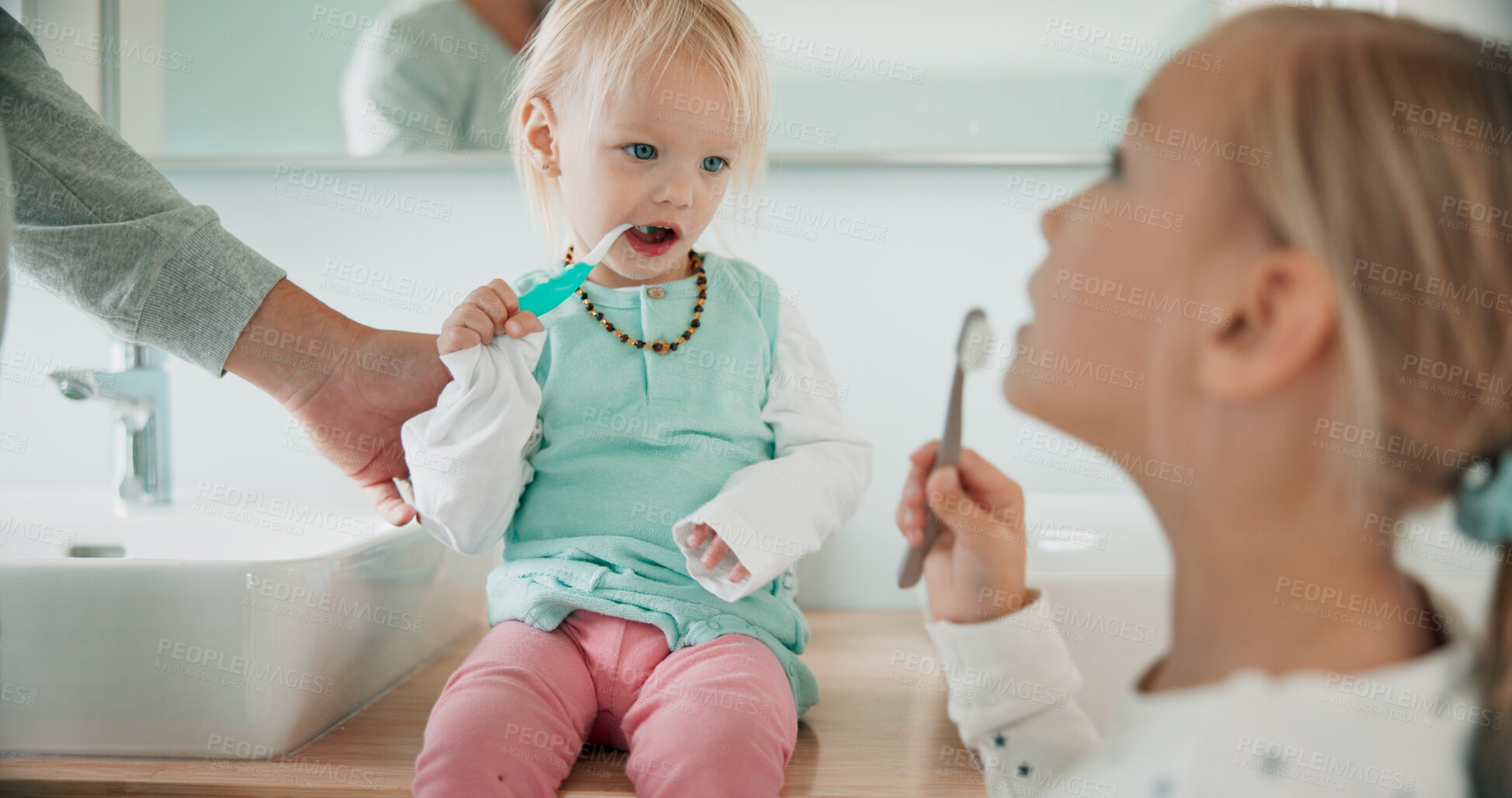 Buy stock photo Hand, family and kids brushing teeth in bathroom for dental care, health or siblings learning oral hygiene. Sisters, parent and girl with toothbrush for cleaning, wellness and morning routine in home
