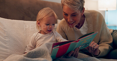 Buy stock photo Grandma, girl and reading book in bed for storytelling, literature and bonding at bedtime. Home, grandparent and child learning together for love, language and support toddler for fiction fairytale