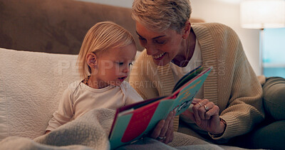 Buy stock photo Grandma, girl and reading book in bed to relax, literature and story for bonding at bedtime. Home, grandparent and child learning together for love, language and support toddler for fiction fairytale