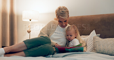 Buy stock photo Grandma, girl and reading in bed for storytelling, literature and bonding or relax at bedtime. Home, grandparent and kid learning together for love, language and support toddler for fiction fairytale