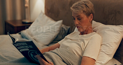 Buy stock photo Old woman, night and reading book in bed to relax, literature and fiction for education. Home, female person and learning in retirement for knowledge, language and fantasy or story for information