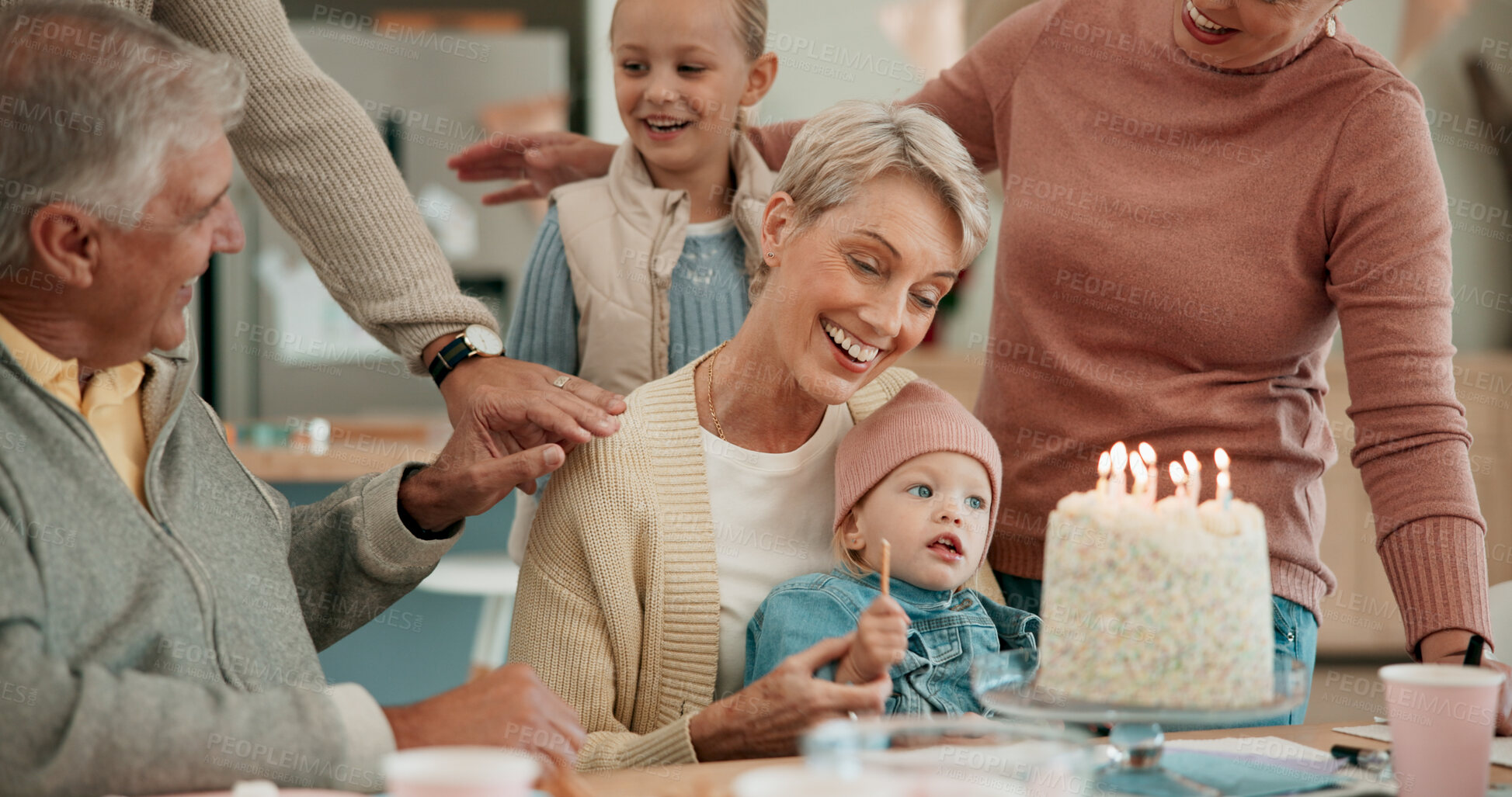 Buy stock photo Happy family, child and birthday with cake for celebration, dessert or wish together on dining table at home. Excited grandparents with grandchild or candle light for party, childhood or bonding