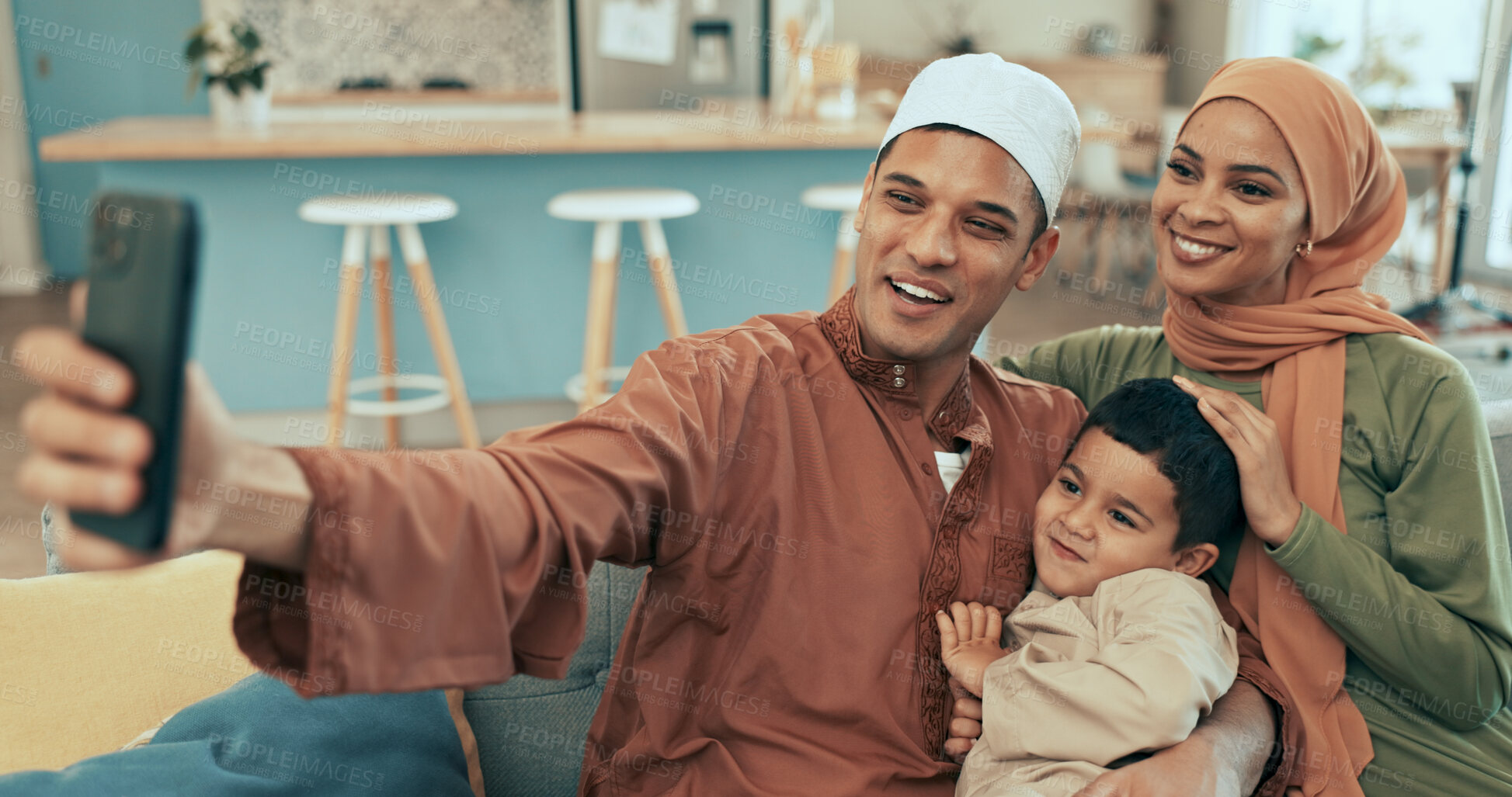 Buy stock photo Muslim family, happy and portrait selfie on sofa, together and bonding with boy. Hijab mother, father and child in picture for islamic new year memory, celebration capture and Muharram mubarak
