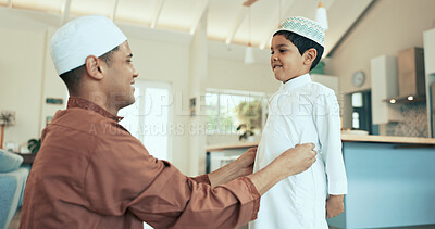 Buy stock photo Muslim family, man and son dressing in home, happy and prayer preparation in Islamic clothes. Father, help and support or thobe adjustment for salaah, care and Malaysian people in apartment together