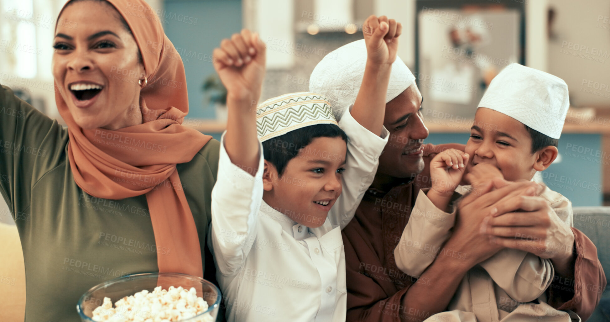 Buy stock photo Muslim family, home and celebration for television in living room, children and Islamic parents with boys together. Popcorn, movie and entertainment with Malaysian people, happy and streaming sports