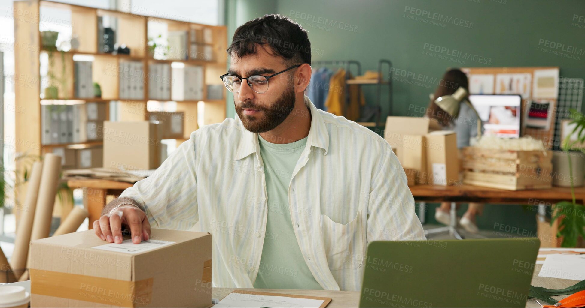 Buy stock photo Tailor, box and laptop in small business for inventory check, order and stock. Shipping package, computer and man at ecommerce startup for fashion delivery logistics with retail seller reading label