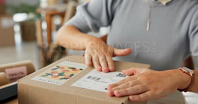 Buy stock photo Woman, hands and package label for delivery of e commerce order, shipping information and courier. Female owner, logistics and box with business sticker, stock packaging and process of distribution
