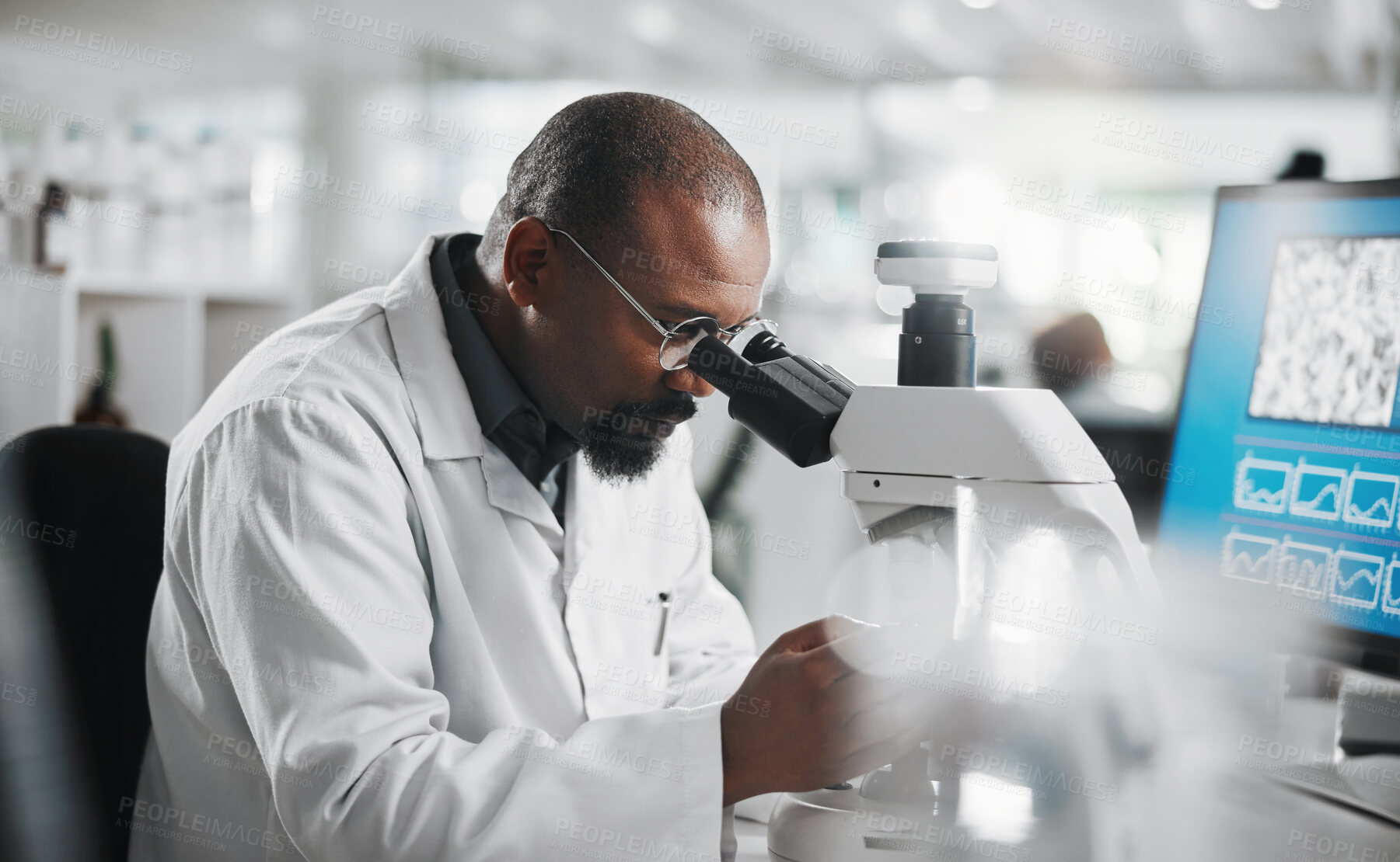 Buy stock photo Black man, computer and microscope in laboratory for analysis, innovation and medical research. Development, scientist and professional person or expert in clinic for diagnosis, cure or health care