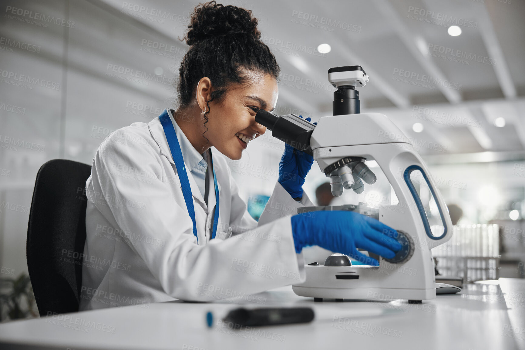 Buy stock photo Microscope, happy woman and science research of study with healthcare, scientist and laboratory work. Analysis, testing and medical professional with microplastic investigation for scientific journal