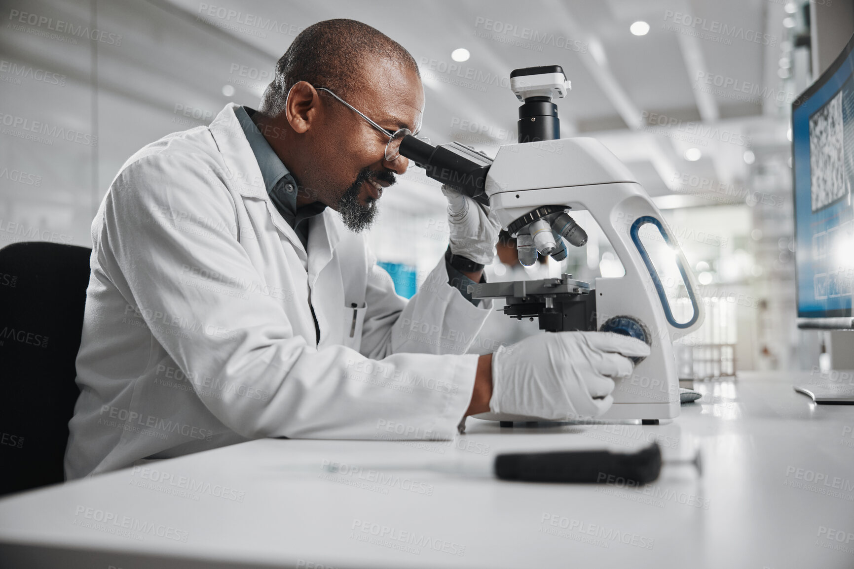 Buy stock photo Science, black man and research with microscope in lab for investigation, development and dna test. Mature scientist, innovation and biotech with review for stem cell, study and growth in vaccinology