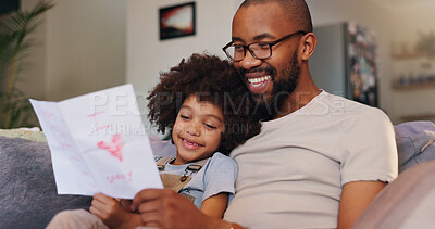 Buy stock photo Card, relax and dad with child in home for fathers day celebration with bonding together. Happy, love and black man hugging boy kid with care for drawing gift on sofa in living room at family house.