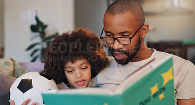 Buy stock photo African man, son and story book on sofa with football, listening and bonding in family house. Father, boy and reading with care, fantasy and relax with love, literature and learning in living room