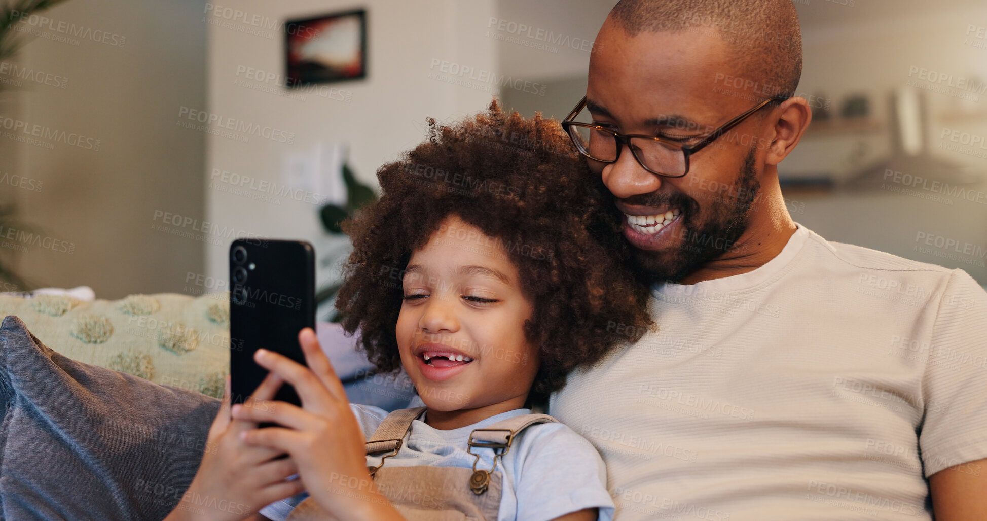 Buy stock photo Phone, dad or boy in home for bonding or streaming online together for movie, website or technology. Happy family, download or single parent father with child, kid or mobile for learning development