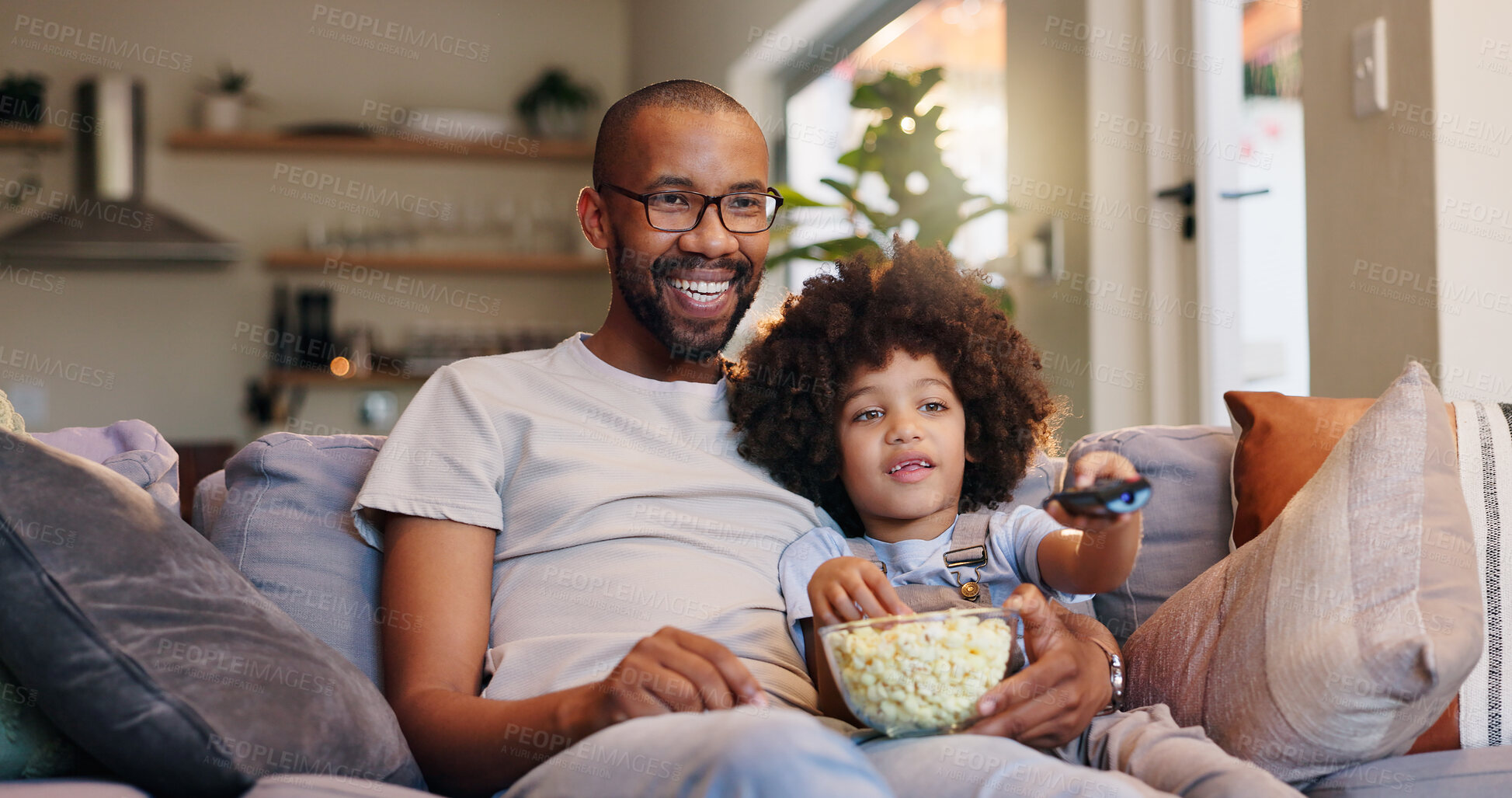 Buy stock photo Dad, boy and smile with television or popcorn on sofa in living room for movies, cartoon and entertainment. People, parent and happy with kid on couch for streaming platform with child development