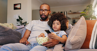 Buy stock photo Dad, boy and watching movie with popcorn on sofa in living room for movies, cartoon and entertainment. People, parent and kid with television on couch for streaming or subscription and childcare