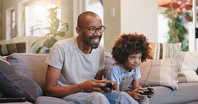 Buy stock photo Father, son and playing games on sofa in house, bonding and people in living room with controllers for esport. Weekend, break and fun together with happy family, childhood and streaming online