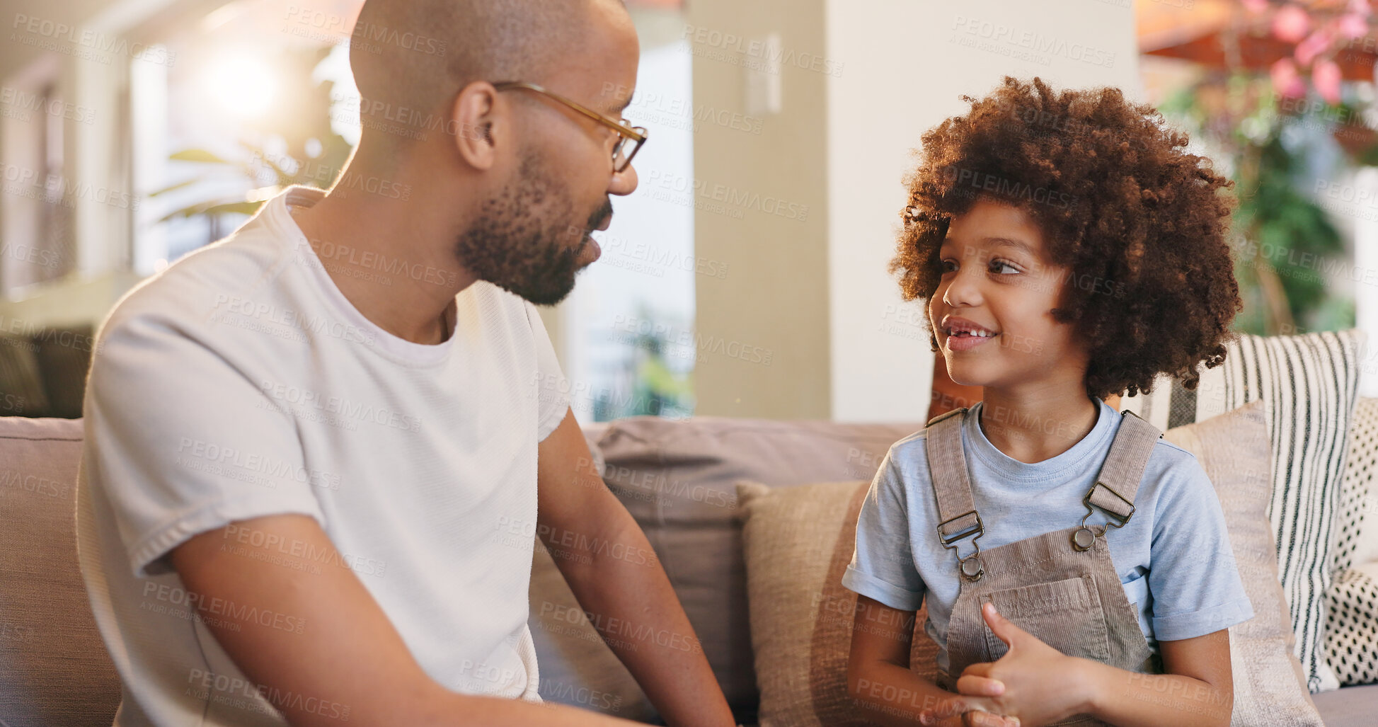 Buy stock photo Father, child and couch in home, conversation and relax in living room for advice and bonding. Communication, support and love in lounge with dad person, chat and care from single parent boy on sofa