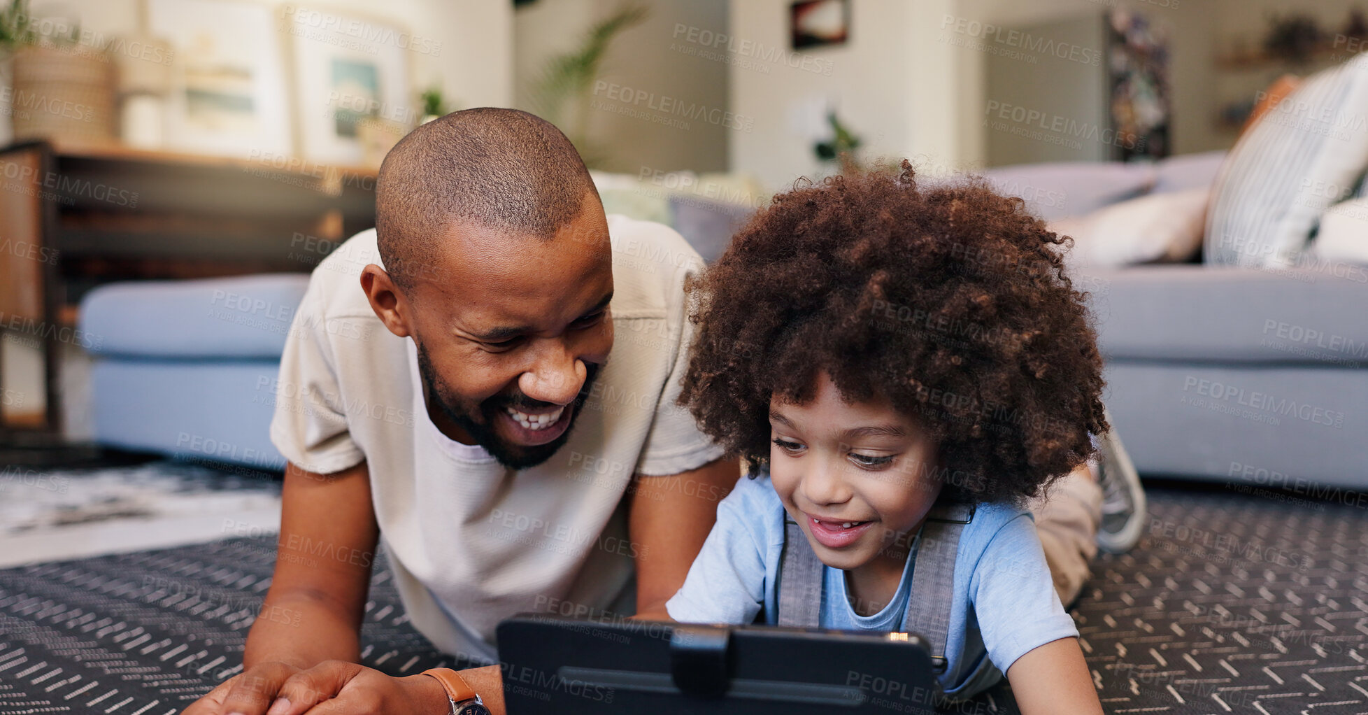 Buy stock photo Distance learning, gaming or tablet with father and son on floor of living room in home for child development. Education, family or streaming tech with single parent man and boy kid in apartment