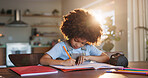 Boy, home and writing homework on table in house, education and school work with kid or notebook. Child development, growth and studying for test or exam, apartment and academic knowledge with pen