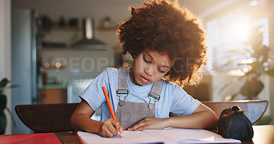 Buy stock photo Boy, home and writing homework on table in house, education and school work with kid or notebook. Child development, growth and studying for test or exam, apartment and academic knowledge with pen