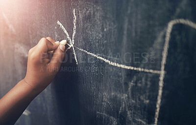 Buy stock photo Cropped shot of a young boy writing on a blackboard at home