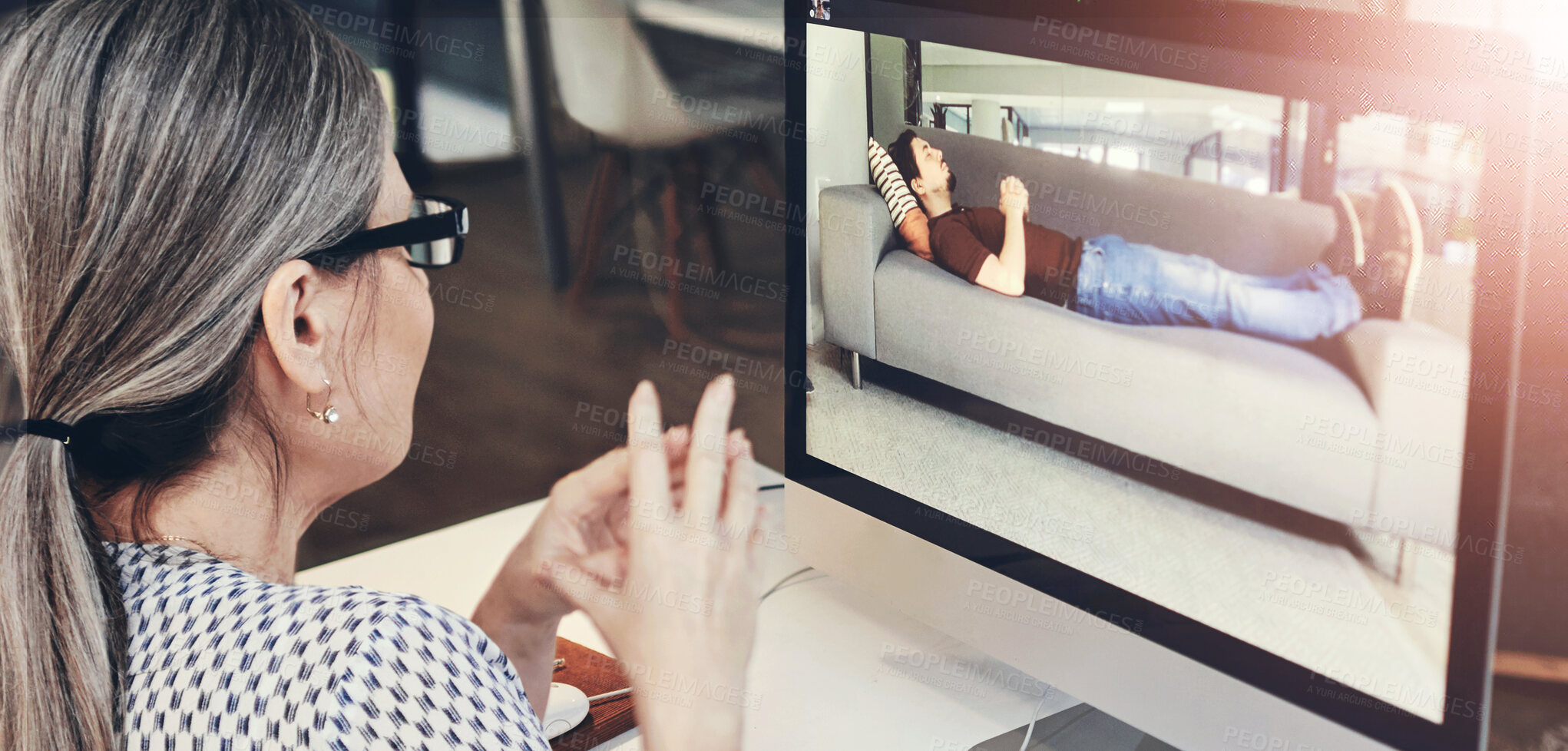 Buy stock photo Shot of a young man having a counselling session with a psychologist using a video conferencing tool