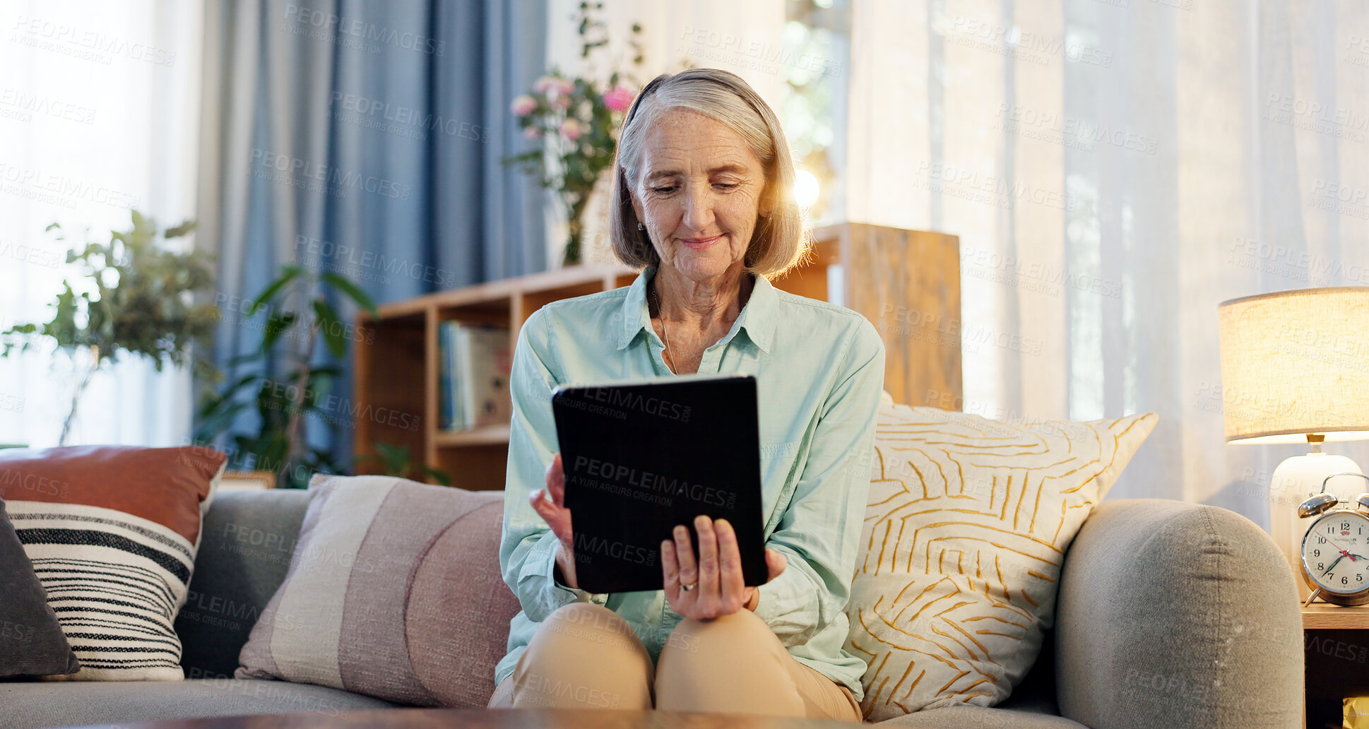 Buy stock photo Senior woman, tablet and typing on sofa for web surfing with retirement, memory game and connection in home. Elderly lady, tech and relax reading ebook, online puzzle and internet scroll on couch