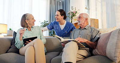 Buy stock photo Senior couple, caregiver and happy on couch in retirement home with fun, trust and support. People, nurse and pensioner with smile for photo album or tablet on sofa with laughing for wellness