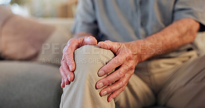 Buy stock photo Senior, man and hands for knee pain in home, arthritis and osteoporosis and leg issue for healthcare. Living room, fibromyalgia and sore joint on couch in lounge, injured and emergency problem