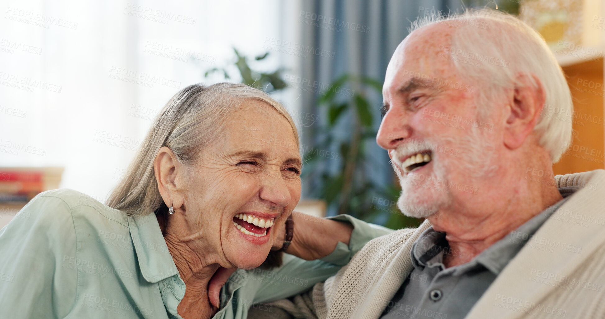 Buy stock photo Senior couple, sofa and laughing together for funny memory, silly story and retirement in nursing home. Elderly man, woman and laugh for bonding, support and love relationship with happiness on couch