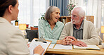 Home, old couple and consultant with documents, retirement plan and conversation for mortgage loan. Financial meeting, man or woman in lounge, paperwork for legal agreement or will with budget advice