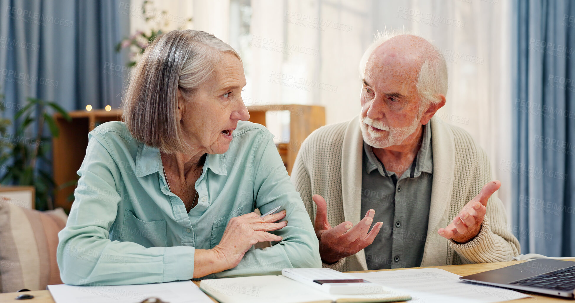 Buy stock photo Home, table and elderly couple with documents in discussion for financial plan, insurance and bills. Tech, retirement and senior people with paper by laptop for healthcare debt, invoice and budgeting