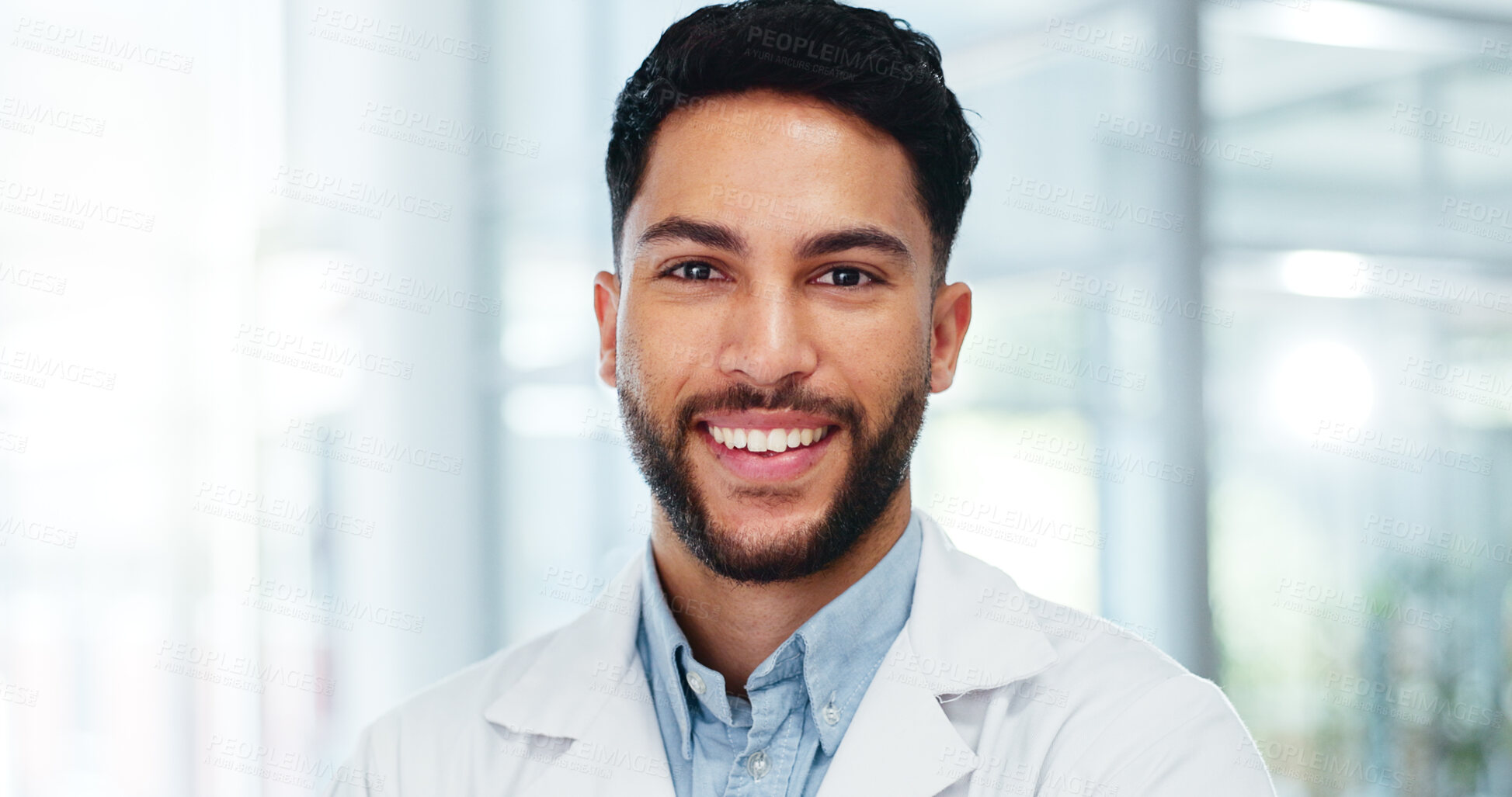 Buy stock photo Healthcare, man and face of doctor in portrait with confidence, pride or medical expertise in hospital. Male surgeon, medicare or smile in lobby for achievement, help or happiness for career success