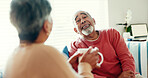 Senior couple, happy and tea time in living room for love, story telling and bonding at home. Elderly man, woman and relax on sofa with laughter, nostalgia and commitment or support in retirement