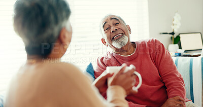 Buy stock photo Senior couple, happy and tea time in living room for love, story telling and bonding at home. Elderly man, woman and relax on sofa with laughter, nostalgia and commitment or support in retirement