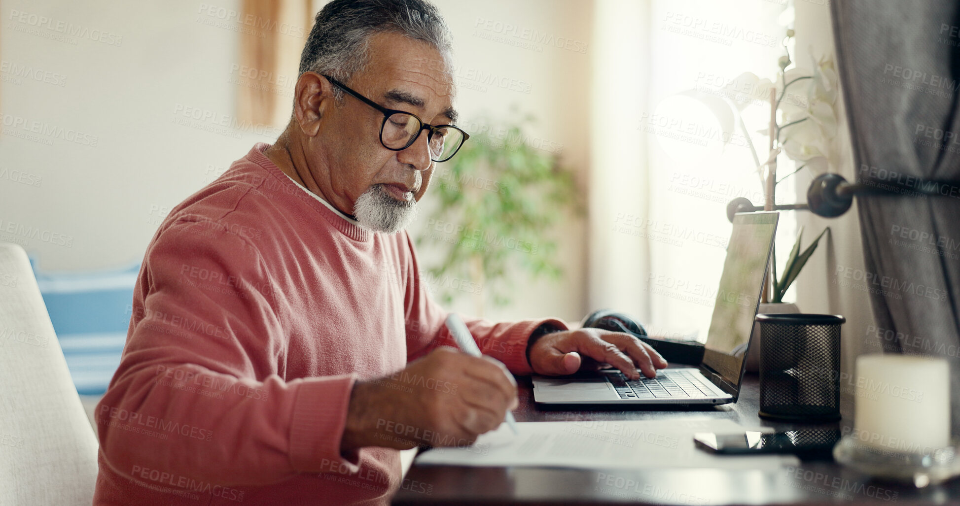 Buy stock photo Senior man, laptop and writing at home for budget, planning and savings account for personal debt. Elderly person, computer and notebook in living room for finance, tax or loan payment on banking app