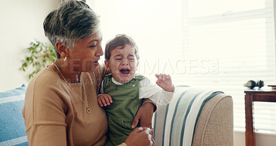 Buy stock photo House, granny and hug for crying baby, sad and comfort in living room, kindness and love. Apartment, grandmother and senior woman with infant, boy and tears with care, emotion or compassion in lounge