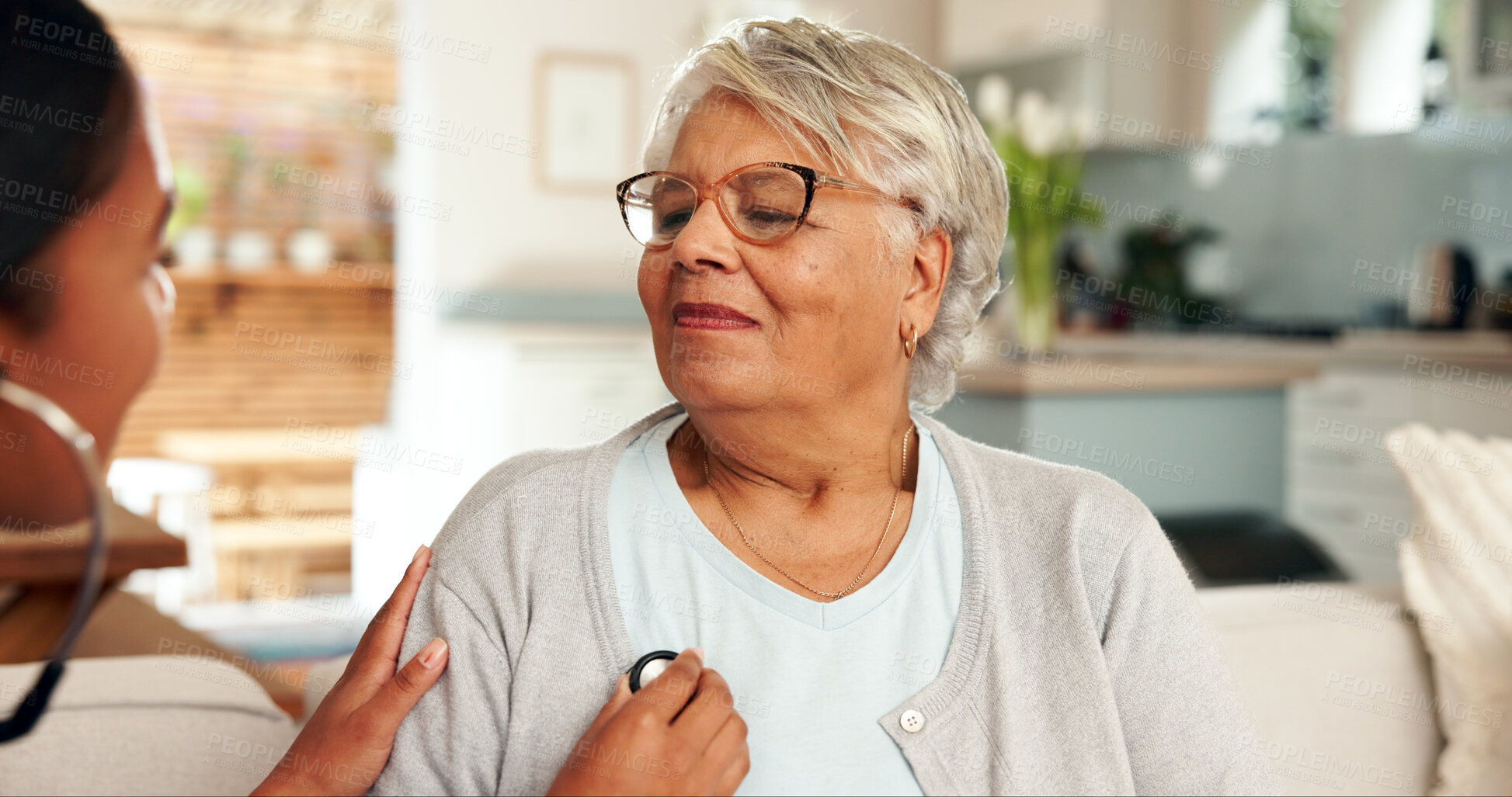 Buy stock photo Elderly woman, nurse and stethoscope on couch for cardiology and medical examination. Heart health, wellness and checkup in home for consultation, breathing and women in living room for assessment 