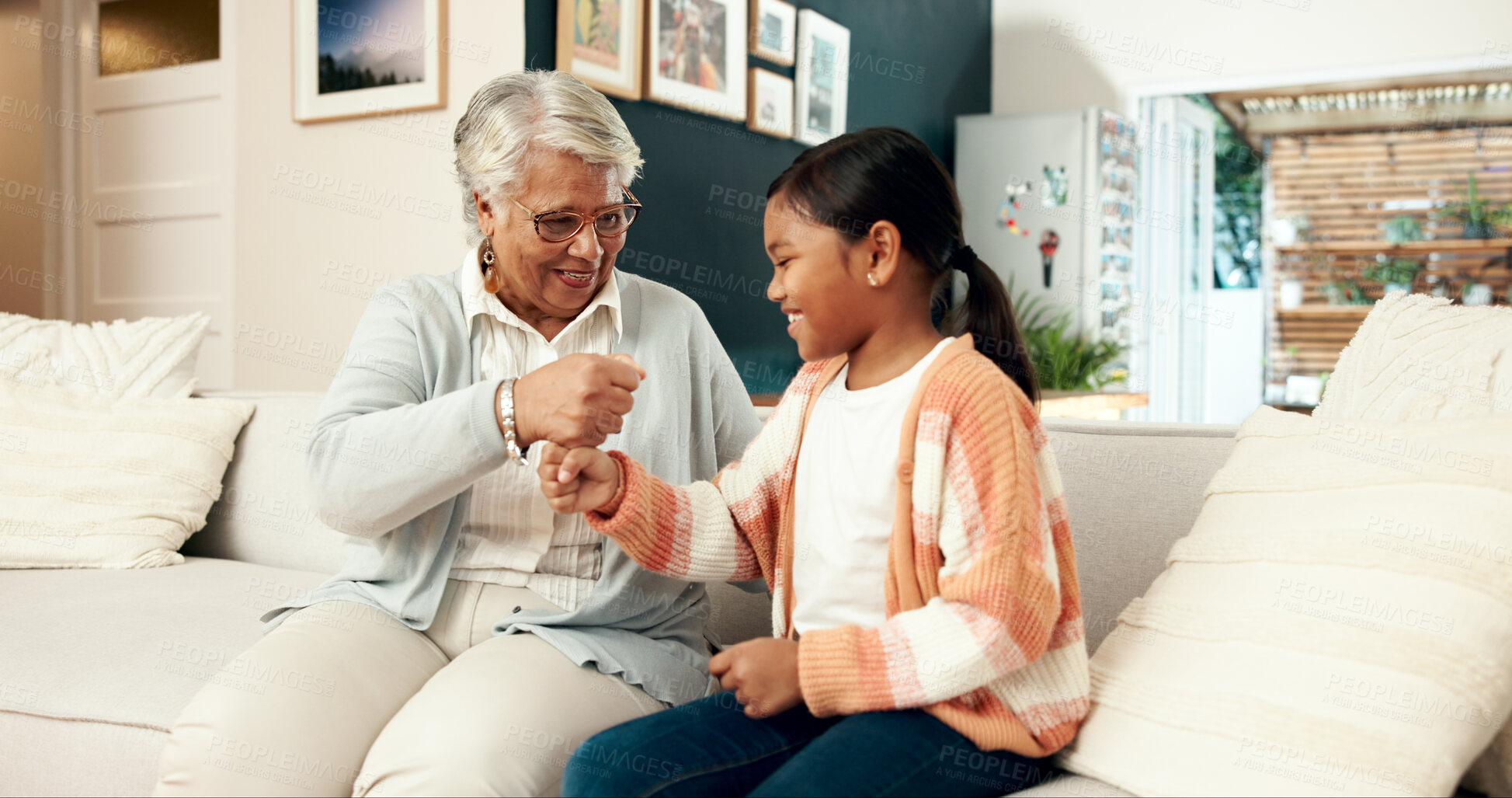 Buy stock photo Hands, fist and stack with child, family in house for playful and fun happiness, bonding together and relax. Granny, home and girl with handshake, game and cheerful with smile, positive and break