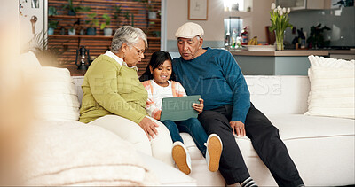 Buy stock photo Tablet, grandparents and happy kid in home on sofa for teaching family internet. Child, grandfather and grandma on technology for learning, relax and girl reading ebook story for education together