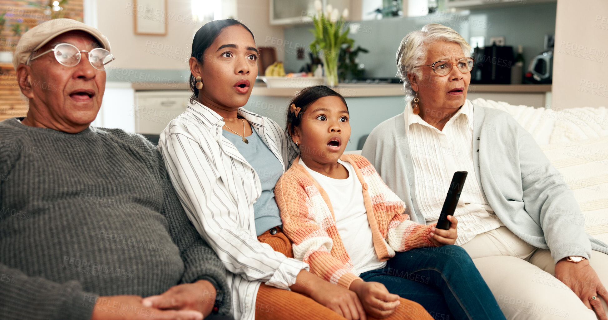Buy stock photo Family, shock and couch in living room, movie and streaming with grandparents in home. Lounge, remote and action series or TV show with female person, bonding and support together for weekend relax