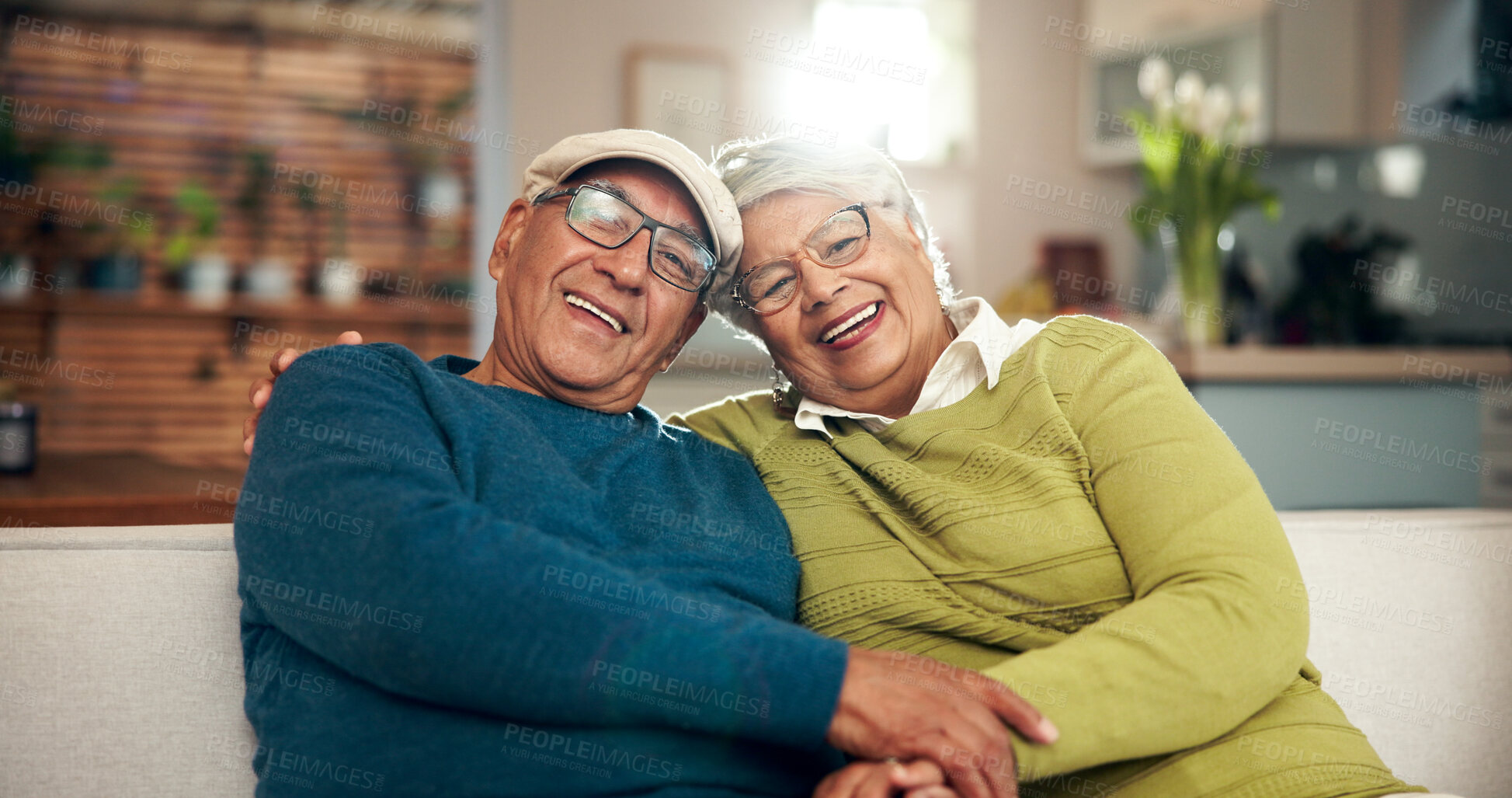 Buy stock photo Smile, portrait and elderly couple on sofa with bonding, support and embrace for relationship memory. Happy, woman and man with love, care and hug together on couch for retirement peace at home